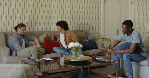 Three Friends Socializing and Relaxing in Cozy Living Room
