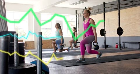 Diverse Women Exercising with Digital Fitness Metrics in Modern Gym