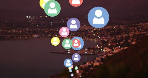Social media icons overlapping sea landscape at dusk