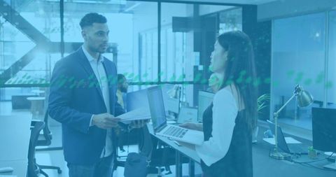 Diverse Business Team Analyzing Financial Data Using Technology