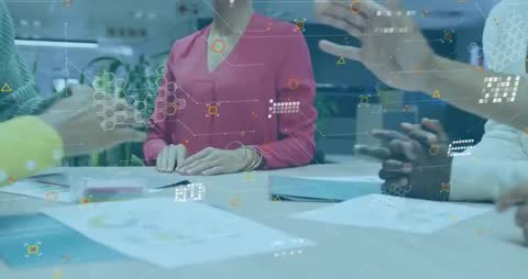 Business Team Collaborating with Technology in Office Meeting