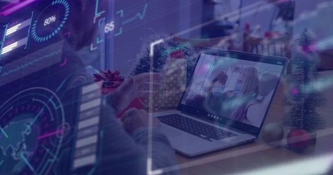 Man holding gift using laptop for virtual holiday celebration