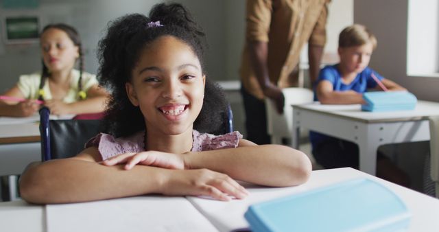 Smiling African American Girl in Classroom with Classmates and Teacher - Download Free Stock Images Pikwizard.com