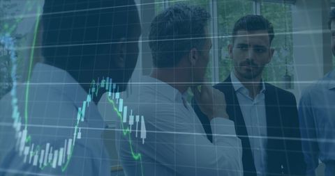 Business Team Discusses Financial Data with Digital Chart Overlay