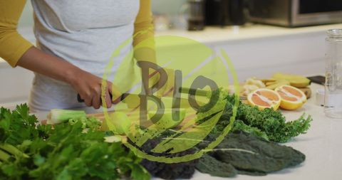 Biracial woman preparing organic vegetables in kitchen