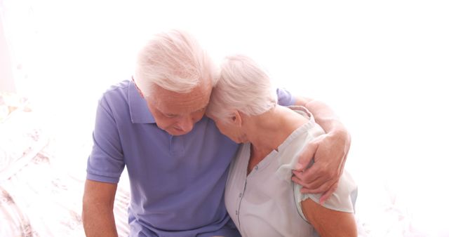 Senior couple embracing each other in hospital