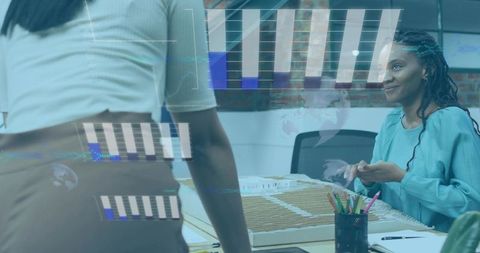 Black woman presenting scale model with augmented data overlays tracking design progress