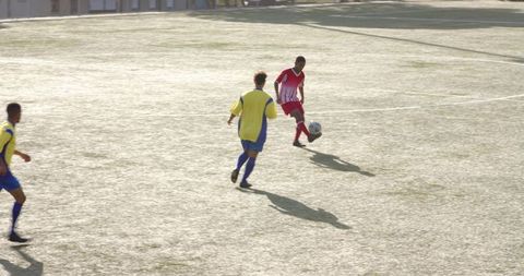 Soccer Players Competing Intently on Sunny Day Match - Download Free Stock Images Pikwizard.com