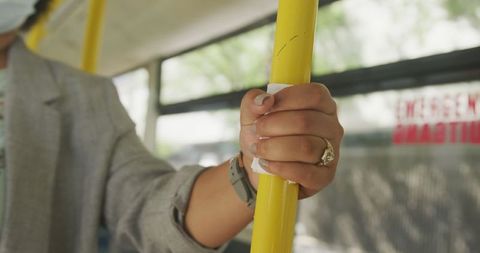 Biracial Woman Wearing Face Mask Holding Bus Rail During Pandemic - Download Free Stock Images Pikwizard.com
