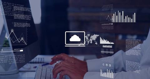 Businessman typing on keyboard while cloud analytics holograms visualizing global data