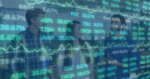 Financial analysts reviewing stock data on transparent display