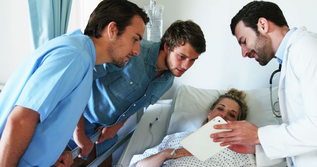 Doctors Presenting Medical Information to Patient in Hospital Room - Download Free Stock Images Pikwizard.com