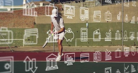 Mid adult male tennis player serving with finance icons overlay