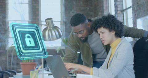 Colleagues Discussing Cybersecurity in Modern Office