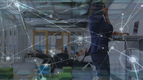 Businesswoman Engaging with Networked Technology in Modern Office Space