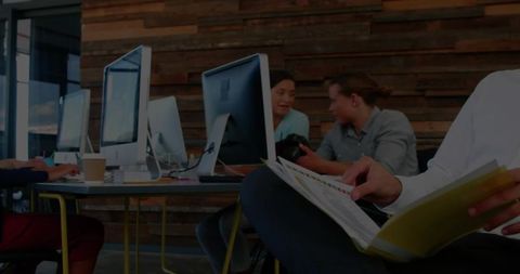 Professional Team Discussion in Modern Office Space