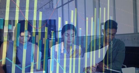 Team reviewing data with laptops and reports in glass office with chart overlay