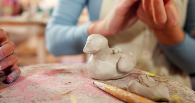 Closeup of Clay Sculptures with Artisan Sculptor Working in Studio - Download Free Stock Images Pikwizard.com