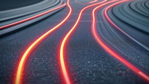 Glowing Curved Neon Light Trails on Night Asphalt Road