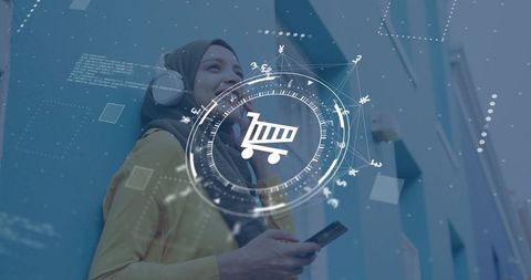 Muslim woman in hijab holding phone listening headphones shopping via mobile ecommerce hud