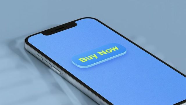 Smartphone showing 3d buy now button on pastel blue screen angled for ecommerce
