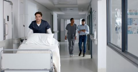 Healthcare Professionals in Hospital Corridor Teamwork - Download Free Stock Images Pikwizard.com