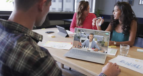 Diverse Team Video Conferencing in Modern Office