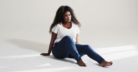 Modern African American Woman Relaxed on Studio Floor