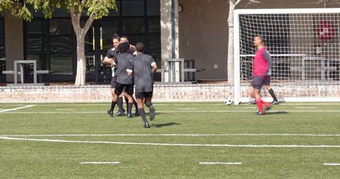 Soccer players warming up on field for intense practice session