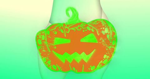 Neon jack-o'-lantern overlay on women's body art