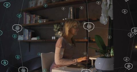 Middle-aged woman typing at home office desk with ai network overlay, remote work concept