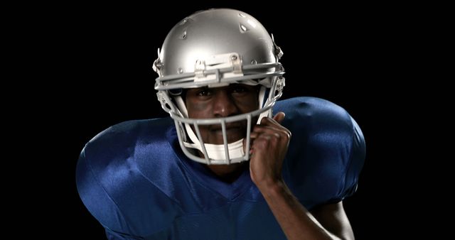 Confident American Football Player in Blue Uniform Ready for Action - Download Free Stock Images Pikwizard.com