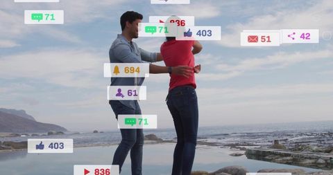 Couple embracing on rocky coast with social media notifications and engagement overlays