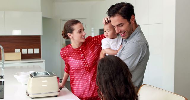 Young Family Enjoying Breakfast Together in Modern Kitchen - Download Free Stock Images Pikwizard.com