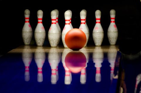 Bowling Ball Approaching Ten-Pins on Polished Alley