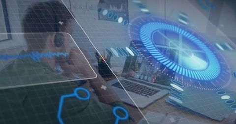 Remote worker wearing headset and using holographic HUD on laptop at home desk
