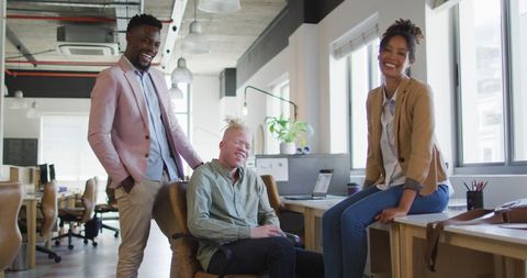 Diverse Colleagues Smiling in Modern Open Office Environment