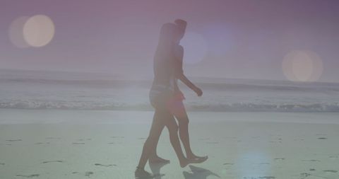 Romantic Couple Strolling Along Sunny Beach with Lens Flares - Download Free Stock Images Pikwizard.com