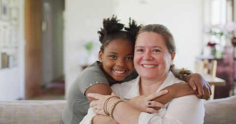 Multicultural Family Embracing and Smiling at Home - Download Free Stock Images Pikwizard.com