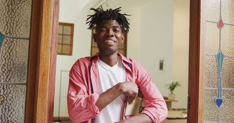 Cheerful craftsman with tablet in workshop seamlessly balancing business