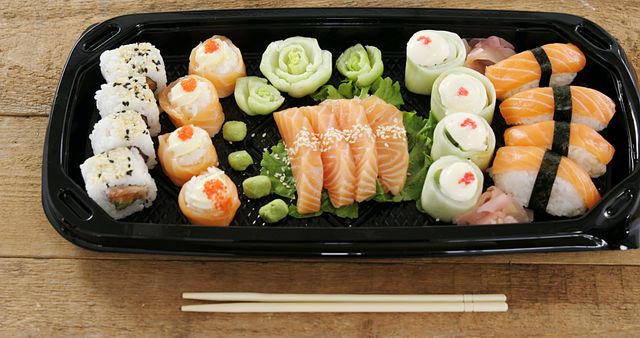 Assortment of Fresh Sushi and Sashimi with Wasabi and Chopsticks - Download Free Stock Images Pikwizard.com