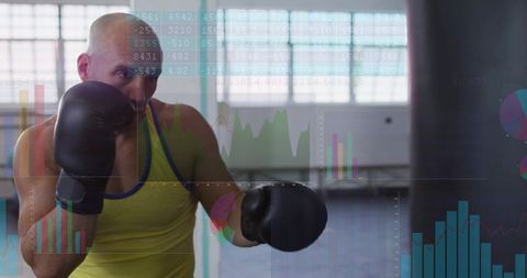 Boxer training with data overlay, athlete jabbing heavy bag with financial charts