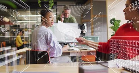 Modern office collaboration with digital data overlay