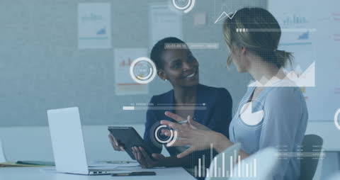 Colleagues Analyzing Data Charts During Team Meeting