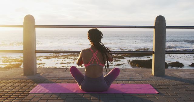 Woman Practicing Yoga on Mat at Seaside Boardwalk During Sunset - Download Free Stock Images Pikwizard.com