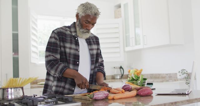 Senior Male Preparing Healthy Meal in Modern Kitchen - Download Free Stock Images Pikwizard.com