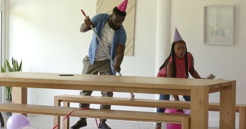 Family setting up party decorations with enthusiasm