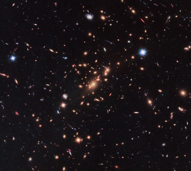 By combining the power of a &quot;natural lens&quot; in space with the capability of NASA's Hubble Space Telescope, astronomers made a surprising discovery—the first example of a compact yet massive, fast-spinning, disk-shaped galaxy that stopped making stars only a few billion years after the big bang.  Finding such a galaxy early in the history of the universe challenges the current understanding of how massive galaxies form and evolve, say researchers.  Read more: <a href="https://go.nasa.gov/2sWwKkc" rel="nofollow">go.nasa.gov/2sWwKkc</a>  caption: Acting as a “natural telescope” in space, the gravity of the extremely massive foreground galaxy cluster MACS J2129-0741 magnifies, brightens, and distorts the far-distant background galaxy MACS2129-1, shown in the top box. The middle box is a blown-up view of the gravitationally lensed galaxy. In the bottom box is a reconstructed image, based on modeling that shows what the galaxy would look like if the galaxy cluster were not present. The galaxy appears red because it is so distant that its light is shifted into the red part of the spectrum.  Credits: NASA, ESA, M. Postman (STScI), and the CLASH team  <b><a href="http://www.nasa.gov/audience/formedia/features/MP_Photo_Guidelines.html" rel="nofollow">NASA image use policy.</a></b>  <b><a href="http://www.nasa.gov/centers/goddard/home/index.html" rel="nofollow">NASA Goddard Space Flight Center</a></b> enables NASA’s mission through four scientific endeavors: Earth Science, Heliophysics, Solar System Exploration, and Astrophysics. Goddard plays a leading role in NASA’s accomplishments by contributing compelling scientific knowledge to advance the Agency’s mission.  <b>Follow us on <a href="http://twitter.com/NASAGoddardPix" rel="nofollow">Twitter</a></b>  <b>Like us on <a href="http://www.facebook.com/pages/Greenbelt-MD/NASA-Goddard/395013845897?ref=tsd" rel="nofollow">Facebook</a></b>  <b>Find us on <a href="http://instagrid.me/nasagoddard/?vm=grid" rel="nofollow">Instagram</a></b>      