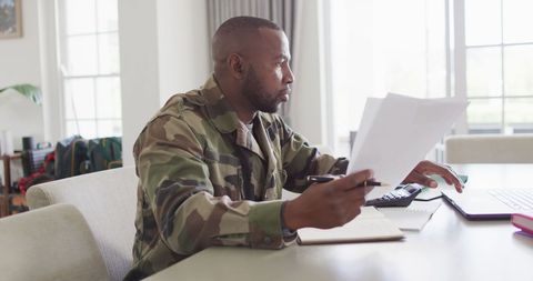 Soldier Balancing Work and Family in Home Office Setting - Download Free Stock Images Pikwizard.com