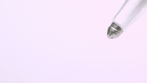 Salt Falling in Slow Motion from a Salt Shaker